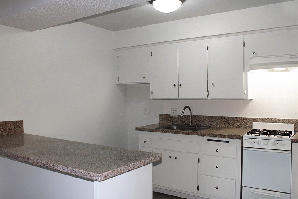 Visually attractive photo of gourmet kitchens image of Academy Pointe Apartments. This photo is the visual representation of gourmet kitchens at Academy Pointe Apartments.